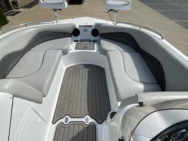 Slide: The Image of The image shows the cockpit of a 2018 Hurricane SS202 boat with gray and white seating. - 26