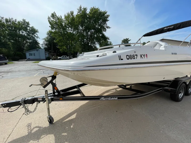 Slide: The Image of A 2018 Hurricane SS202 boat on a trailer, parked on a concrete lot. - 9
