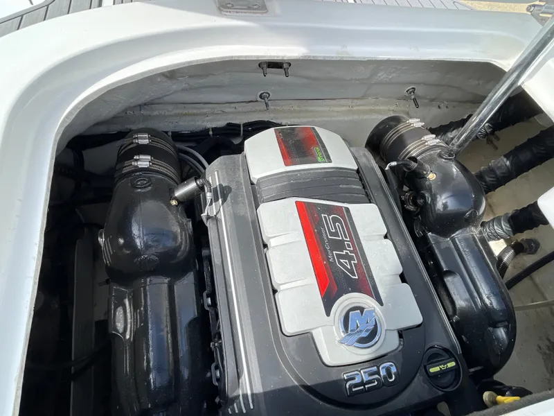 Slide: The Image of A powerful engine in a boat, featuring shiny black components and a silver casing. - 33