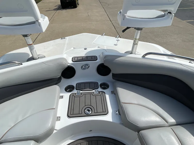 Slide: The Image of The image shows the bow of a 2018 Hurricane SS202 boat with gray upholstery and cup holders. - 31