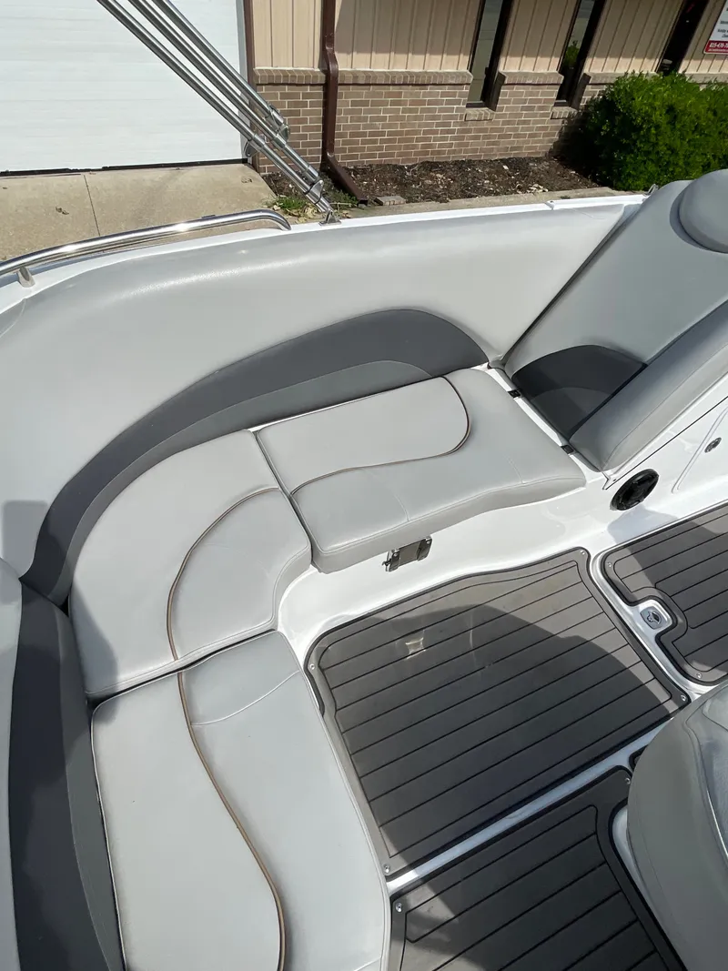 Slide: The Image of The image shows the gray upholstery of a 2018 Hurricane SS202 with sleek stitching. - 17