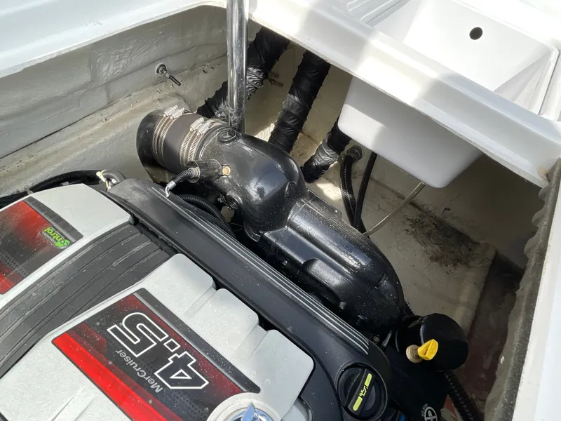 Slide: The Image of An engine compartment with a Volvo Penta 4.3 engine in a Hurricane SS202 boat. - 34