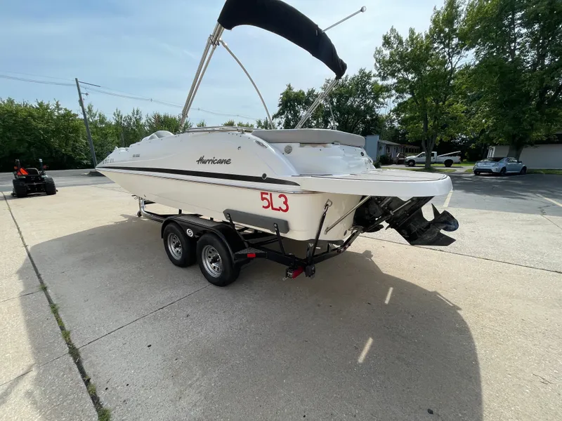 Slide: The Image of A 2018 Hurricane SS202 boat on a trailer in a paved area. - 6