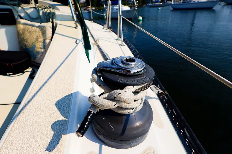 Slide: The Image of Winch on 1988 Tartan 34-2 sailboat deck, moored in a marina. - 20