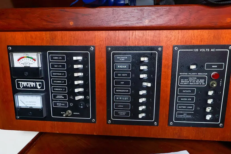 Slide: The Image of Electrical control panel on a 1988 Tartan 34-2 sailboat with various switches and gauges. - 40