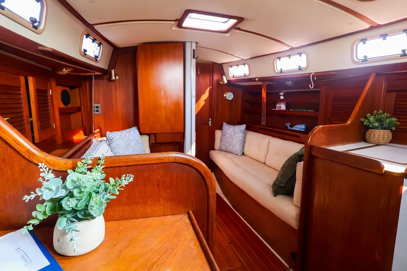 Slide: The Image of Cozy interior of 1988 Tartan 34-2 sailboat with wooden finish and comfortable seating. - 27