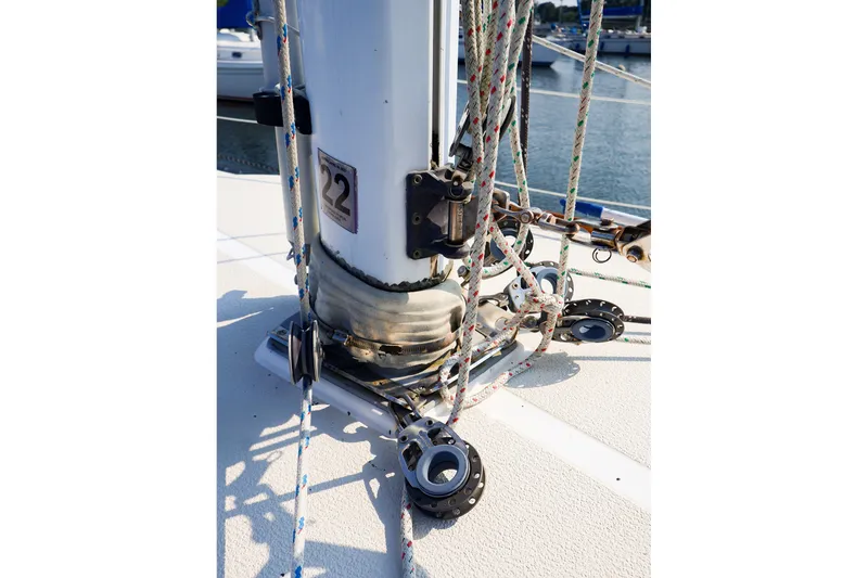 Slide: The Image of Close-up of 1988 Tartan 34-2 sailboat mast base with rigging and ropes. - 23