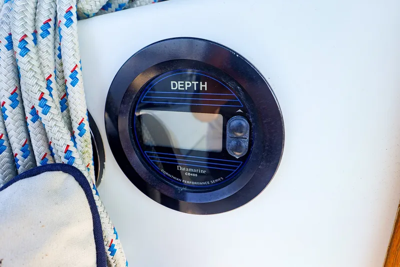 Slide: The Image of Depth gauge on 1988 Tartan 34-2 sailboat with nautical ropes nearby. - 18