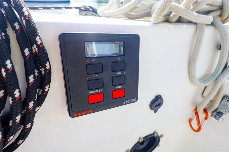 Slide: The Image of Autopilot control panel on 1988 Tartan 34-2 sailboat with ropes nearby. - 14