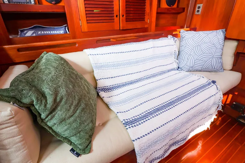 Slide: The Image of Cozy interior of 1988 Tartan 34-2 sailboat with cushions and striped blanket. - 29