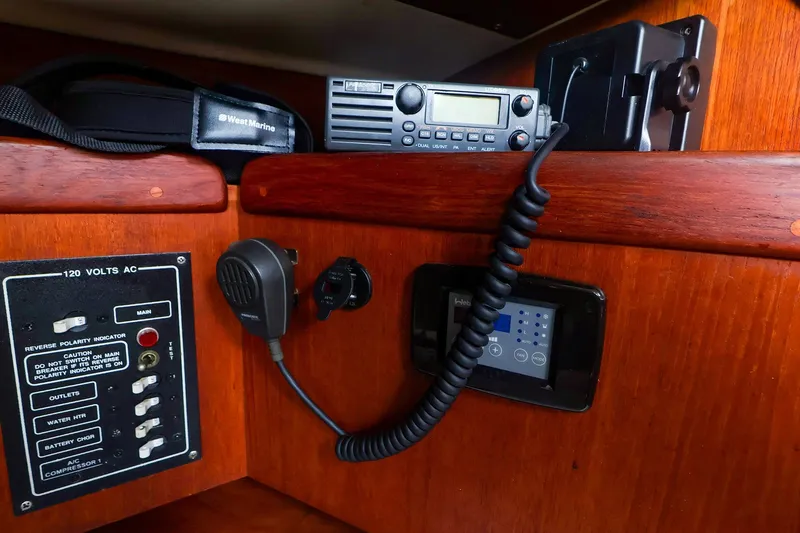 Slide: The Image of Control panel and radio equipment inside a 1988 Tartan 34-2 sailboat cabin. - 41