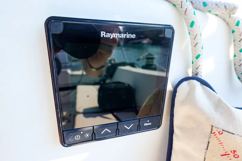 Slide: The Image of Raymarine display on 1988 Tartan 34-2 sailboat, with nautical rope and cushion nearby. - 19
