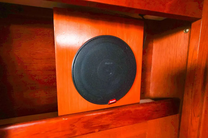 Slide: The Image of Black speaker mounted on wooden panel inside a 1988 Tartan 34-2 boat. - 44