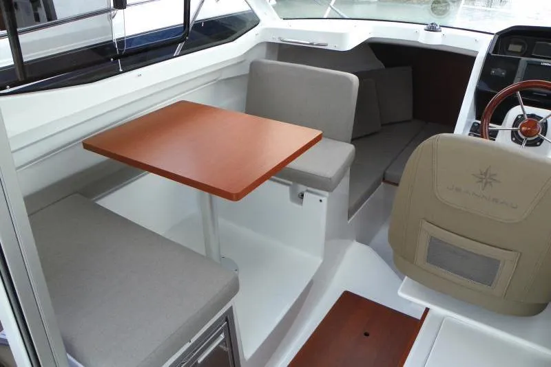 Slide: The Image of Manufacturer Provided Image: 2019 Jeanneau NC 695 interior with seating and table. - 5