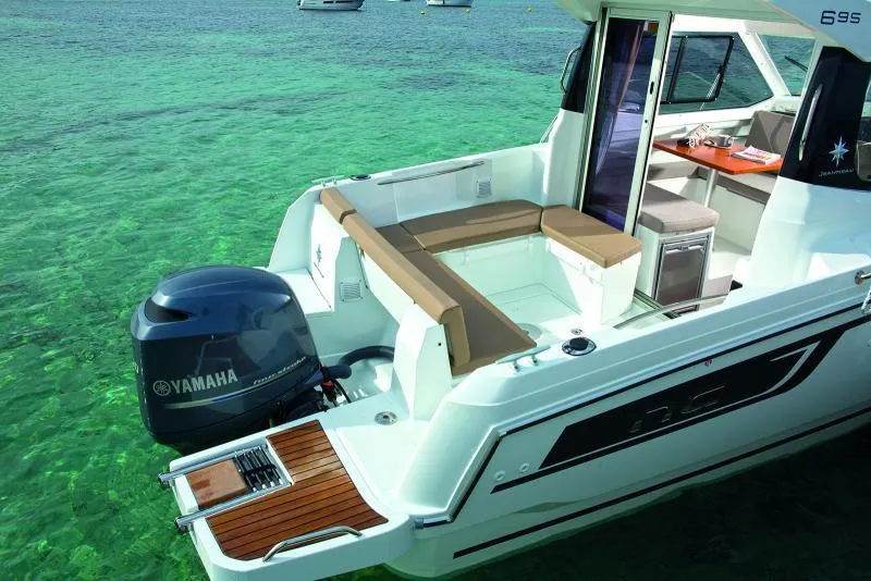 Slide: The Image of Manufacturer Provided Image: 2019 Jeanneau NC 695 boat with Yamaha outboard motor on clear water. - 4