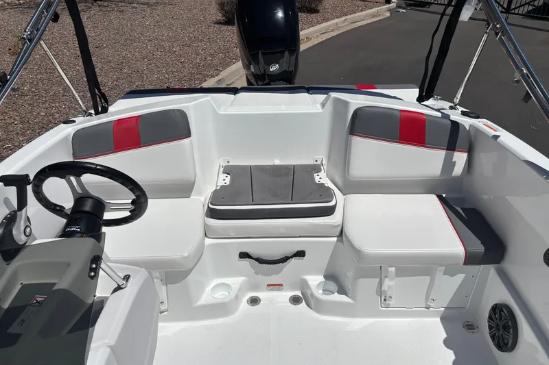 Slide: The Image of 2027 Tahoe T16 boat interior with seating and steering wheel, featuring modern design elements. - 16
