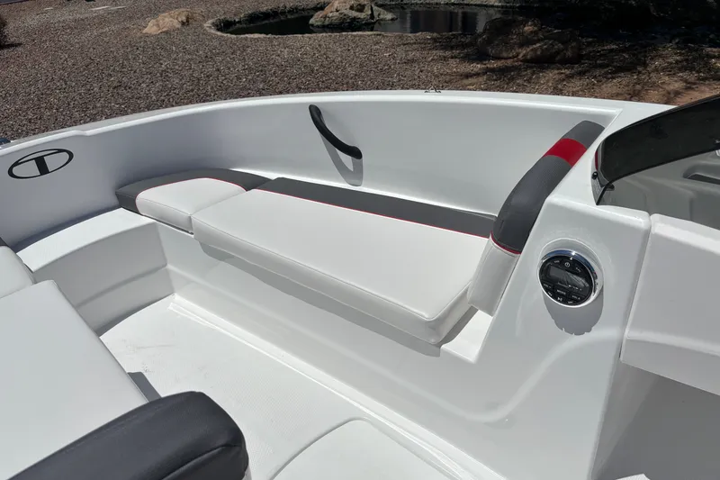 Slide: The Image of 2027 Tahoe T16 boat interior with sleek white seating and modern design elements. - 11