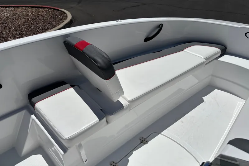 Slide: The Image of 2027 Tahoe T16 boat interior with white and black seating, featuring red accents. - 10