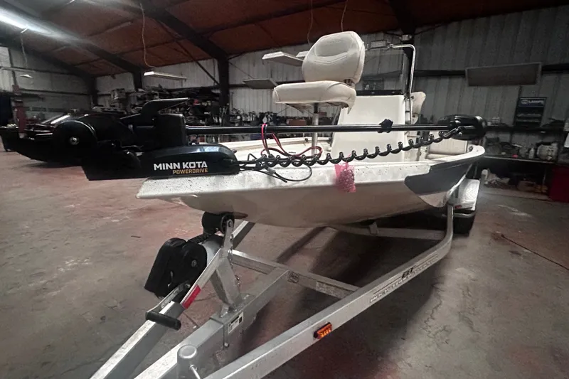 Slide: The Image of 2016 Xpress H18 Bay boat with Minn Kota PowerDrive in a garage setting. - 24