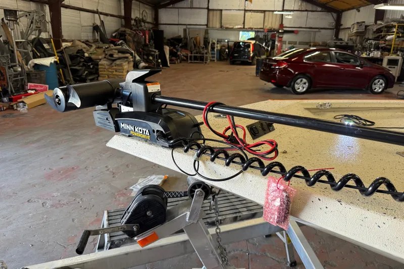 Slide: The Image of Minn Kota PowerDrive motor on 2016 Xpress H18 Bay boat in a workshop. - 9