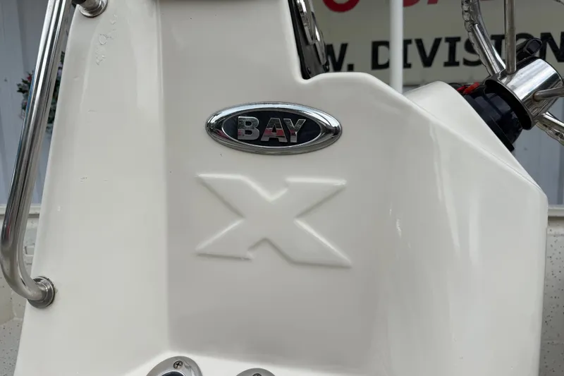 Slide: The Image of 2016 Xpress H18 Bay boat console with steering wheel and logo. - 13