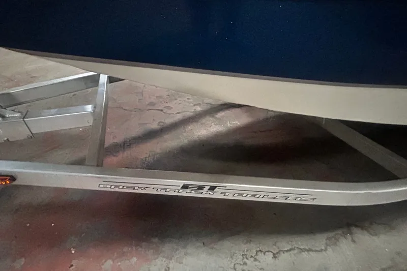 Slide: The Image of Trailer for 2016 Xpress H18 Bay boat on concrete floor. - 23