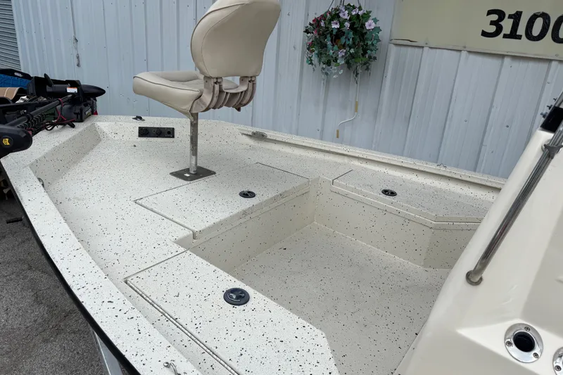 Slide: The Image of 2016 Xpress H18 Bay boat deck with swivel seat and storage compartments. - 14