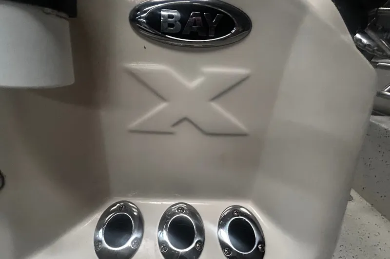 Slide: The Image of 2016 Xpress H18 Bay boat detail with logo and chrome fittings. - 21
