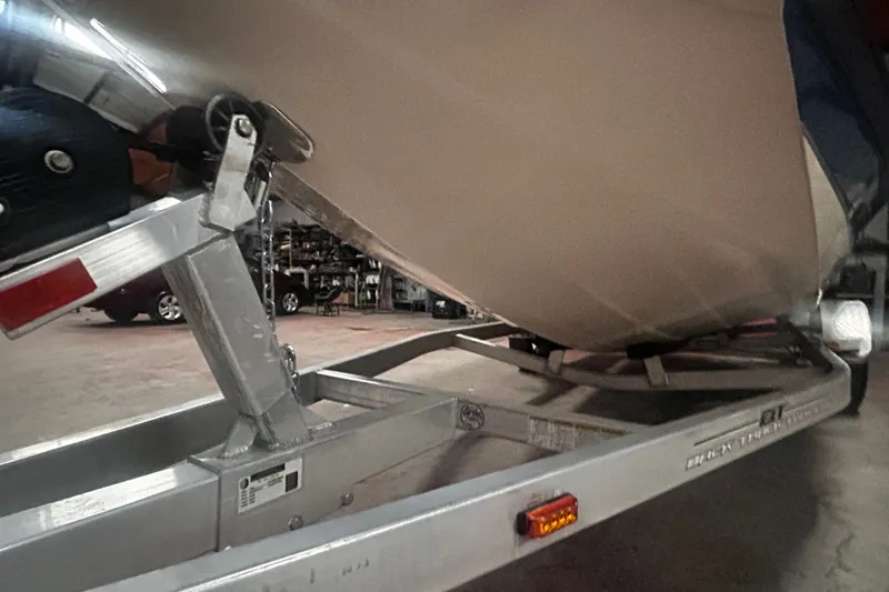 Slide: The Image of 2016 Xpress H18 Bay boat on trailer in a garage setting. - 17
