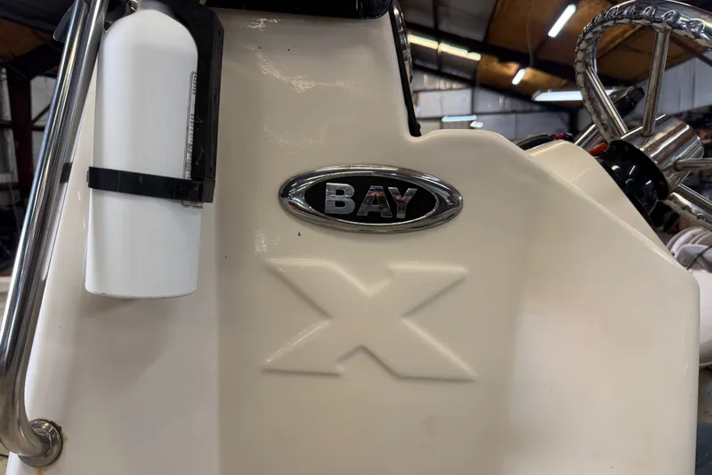 Slide: The Image of 2016 Xpress H18 Bay boat interior with steering wheel and fire extinguisher. - 19