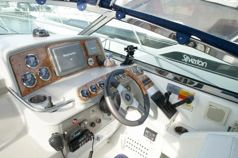 Slide: The Image of The cockpit of a 2006 Formula 31 Performance Cruiser with modern instruments and a steering wheel. - 25