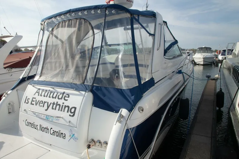 Slide: The Image of A 2006 Formula 31 Performance Cruiser docked. The boat displays "Attitude Is Everything." - 3