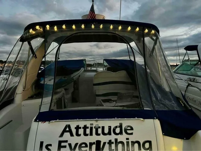 Slide: The Image of 2006 Formula 31 Performance Cruiser with a lit canopy and American flag. - 7