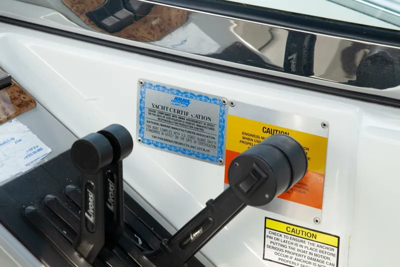 Slide: The Image of Close-up of the control console with certification plaque and caution labels. - 22