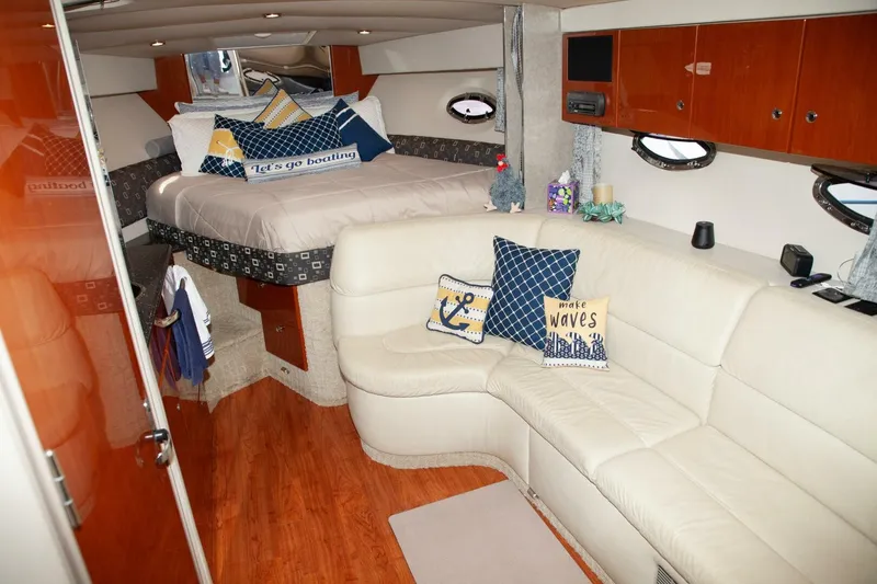 Slide: The Image of Interior of a 2006 Formula 31 Performance Cruiser with cozy bed, cushions, and seating area. - 21