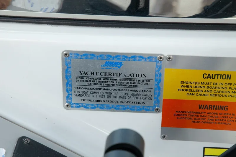 Slide: The Image of Close-up of a certification plaque on a boat with safety and warning labels. - 24