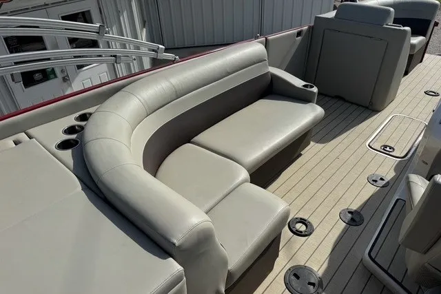 Slide: The Image of 2018 Larson Escape 23 Triple TTT boat with spacious seating and cup holders on deck. - 15