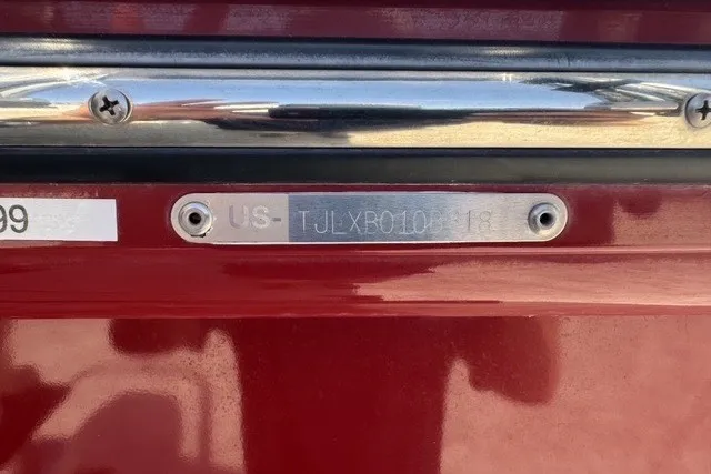 Slide: The Image of VIN plate on a 2018 Larson Escape 23 Triple TTT boat. - 17