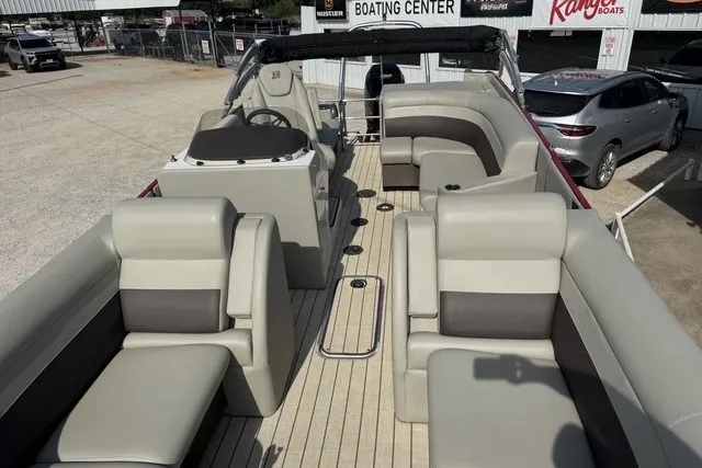 Slide: The Image of 2018 Larson Escape 23 Triple TTT pontoon boat with spacious seating and modern design. - 12