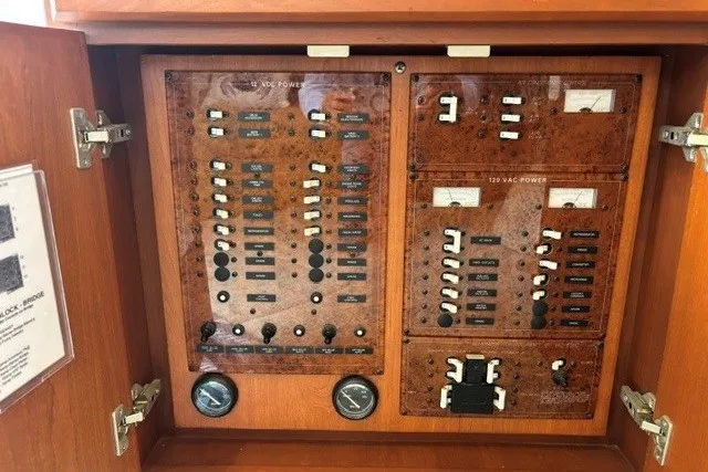 Slide: The Image of Electrical panel of a 2006 Silverton 34 Convertible boat, featuring various switches and gauges. - 10