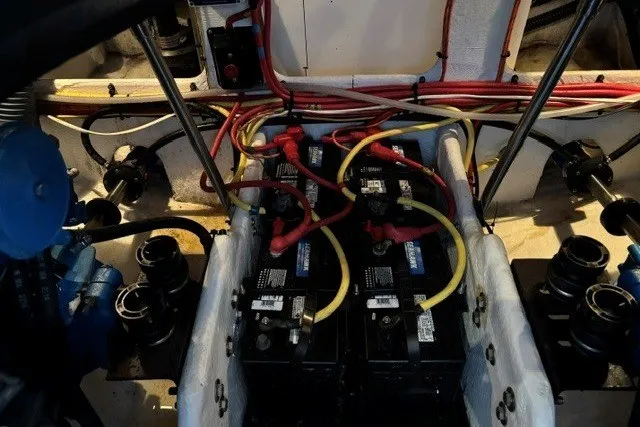 Slide: The Image of Engine compartment of a 2006 Silverton 34 Convertible with visible wiring and batteries. - 27