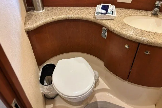 Slide: The Image of Bathroom interior of a 2006 Silverton 34 Convertible yacht with modern amenities. - 13