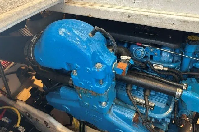 Slide: The Image of Engine compartment of a 2006 Silverton 34 Convertible boat, featuring a blue engine component. - 25