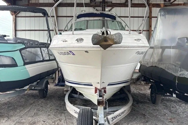Slide: The Image of 2005 Sea Ray 270 Amberjack boat on trailer in storage facility. - 2