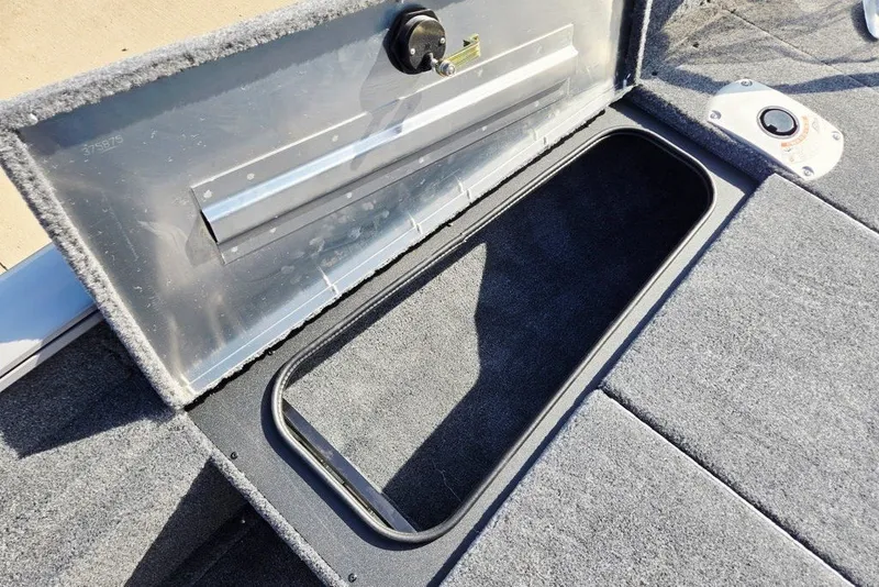 Slide: The Image of Open storage compartment on 2027 Tracker Pro Team 175 Crappie Edition boat. - 39