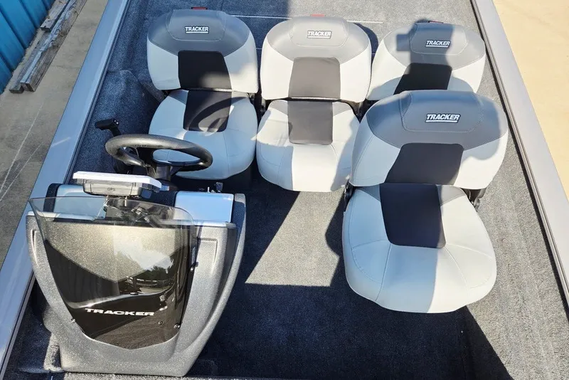 Slide: The Image of 2027 Tracker Pro Team 175 Crappie Edition boat interior with four seats and steering console. - 20