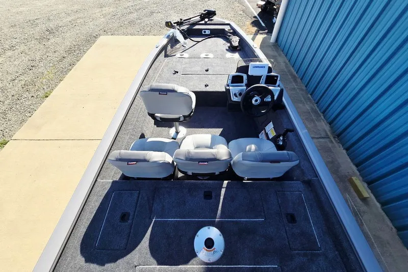 Slide: The Image of 2027 Tracker Pro Team 175 Crappie Edition boat interior with seating and control panel. - 13