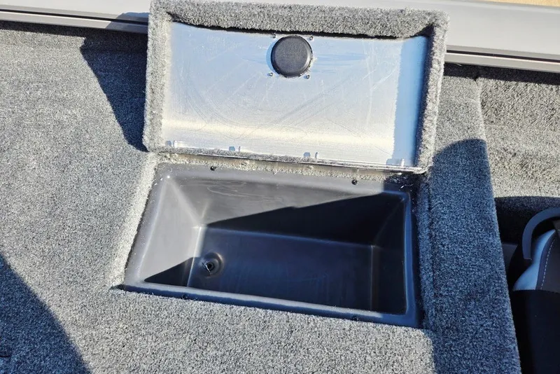 Slide: The Image of Open storage compartment in 2027 Tracker Pro Team 175 Crappie Edition boat. - 14