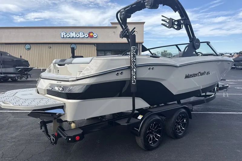 Slide: The Image of A modern 2027 MasterCraft NXT23 on a trailer, ready for watersport adventures. - 5