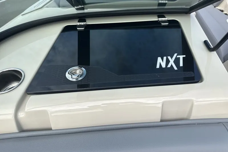 Slide: The Image of The image shows a cover with the NXT logo on a MasterCraft boat. - 18